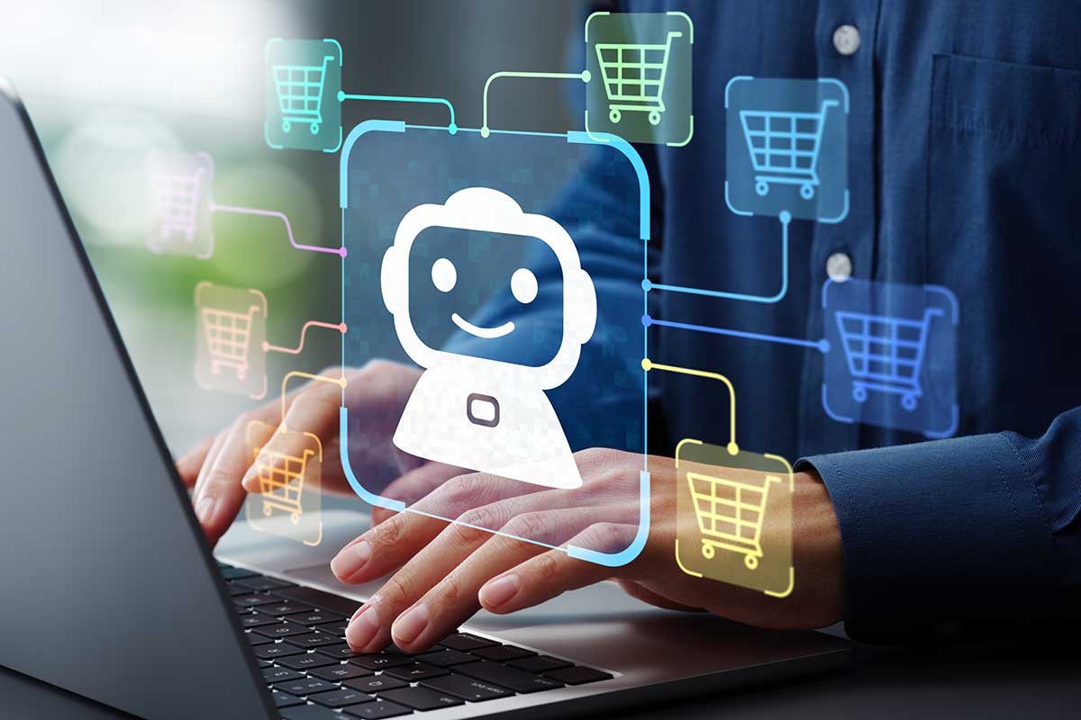 Hands typing on a laptop with a digital AI chatbot icon connected to multiple shopping cart symbols, representing AI-powered ecommerce and B2B automation.